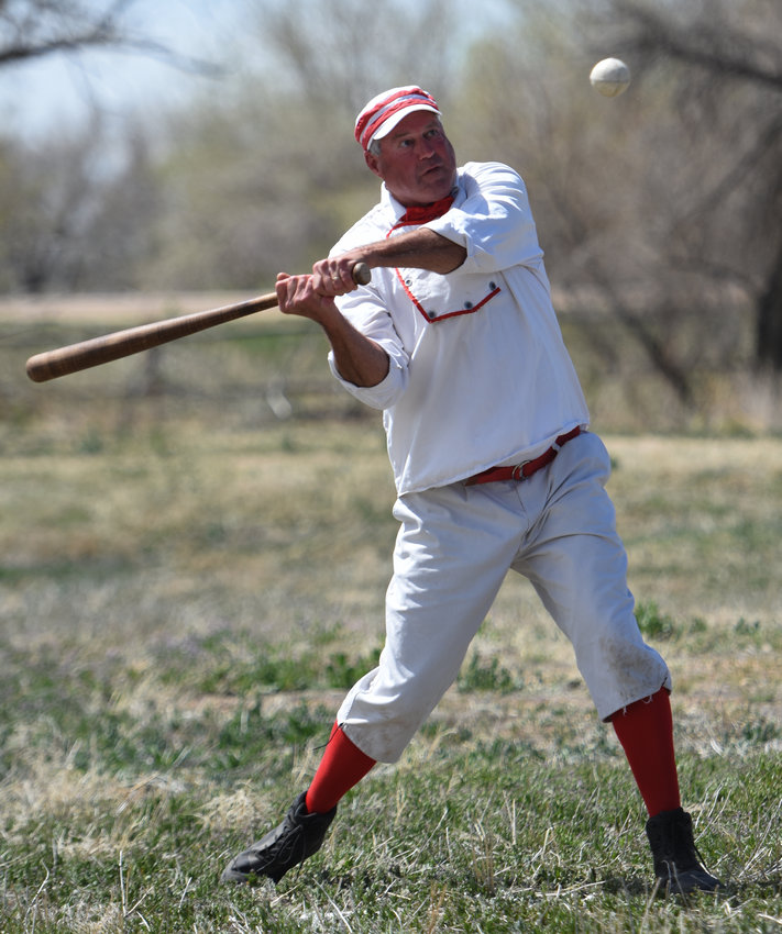 Craig "Big Country" Macari, of Woodland Park, batting or "striking" for the Colorado Springs/Denver & Rio Grande Railroad team, swings at a pitch during a Colorado Vintage Base Ball game, held as part of the South Platte Historical Society's Heritage Fair May 7 in Fort Lupton.